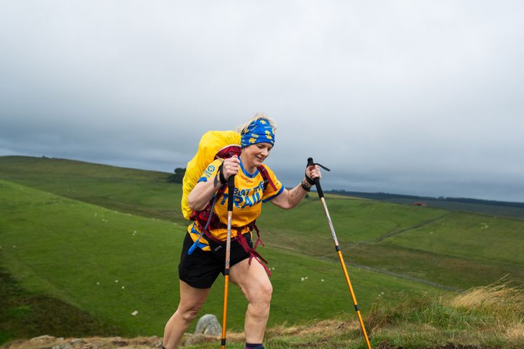 Beat the Trail participant with walking poles