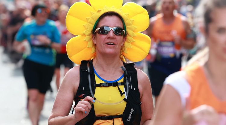 Dr Sarah Holmes running in a daffodil costume