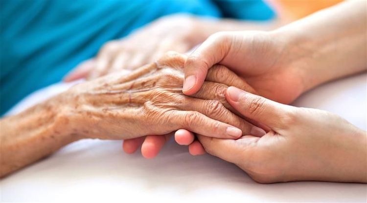 Two people holding hands