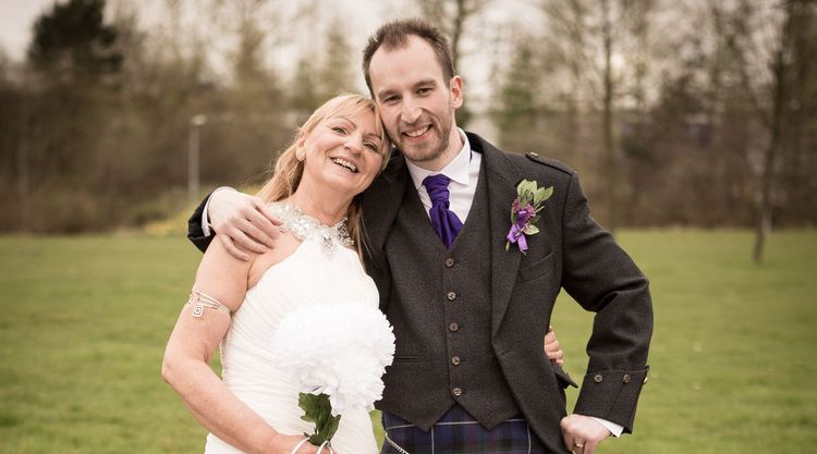 Thomas and Sheena smiling on their wedding day