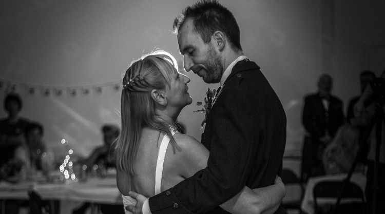 Thomas and Sheena embrace on their wedding day