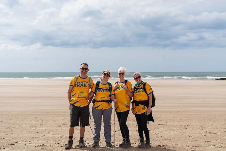 Beat the Trails participants on a beach