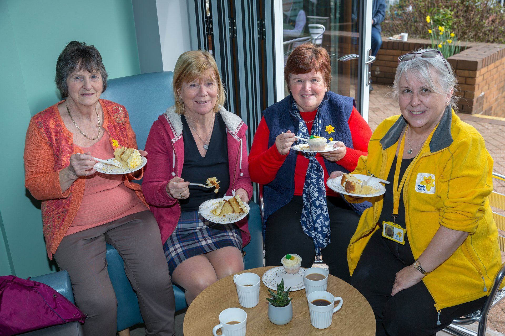 Members of the Caerphilly fundraising group enjoying some tea and cake at the new Marie Curie Cafe